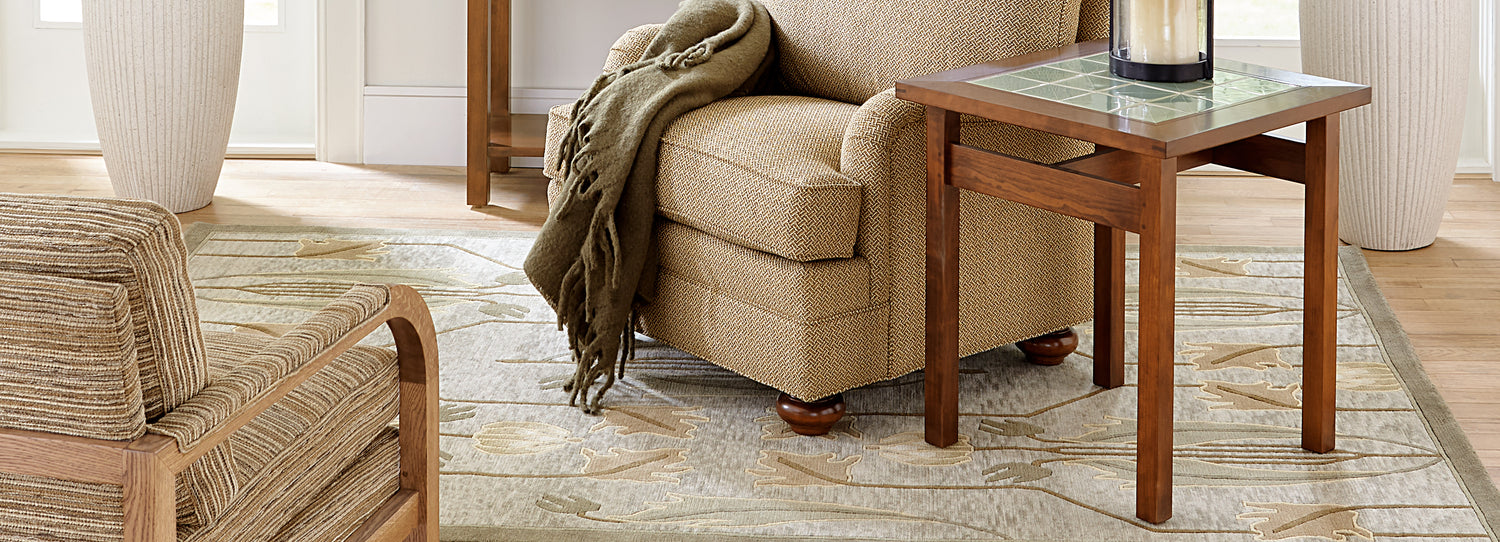 Stickley living room setup featuring light gray designer rug with beige print