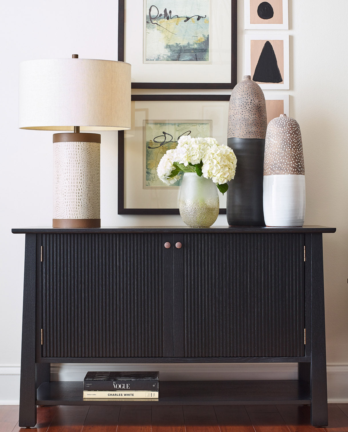 Stickley Park Slope collection side table with lamps, decorative vases, and flowers on top