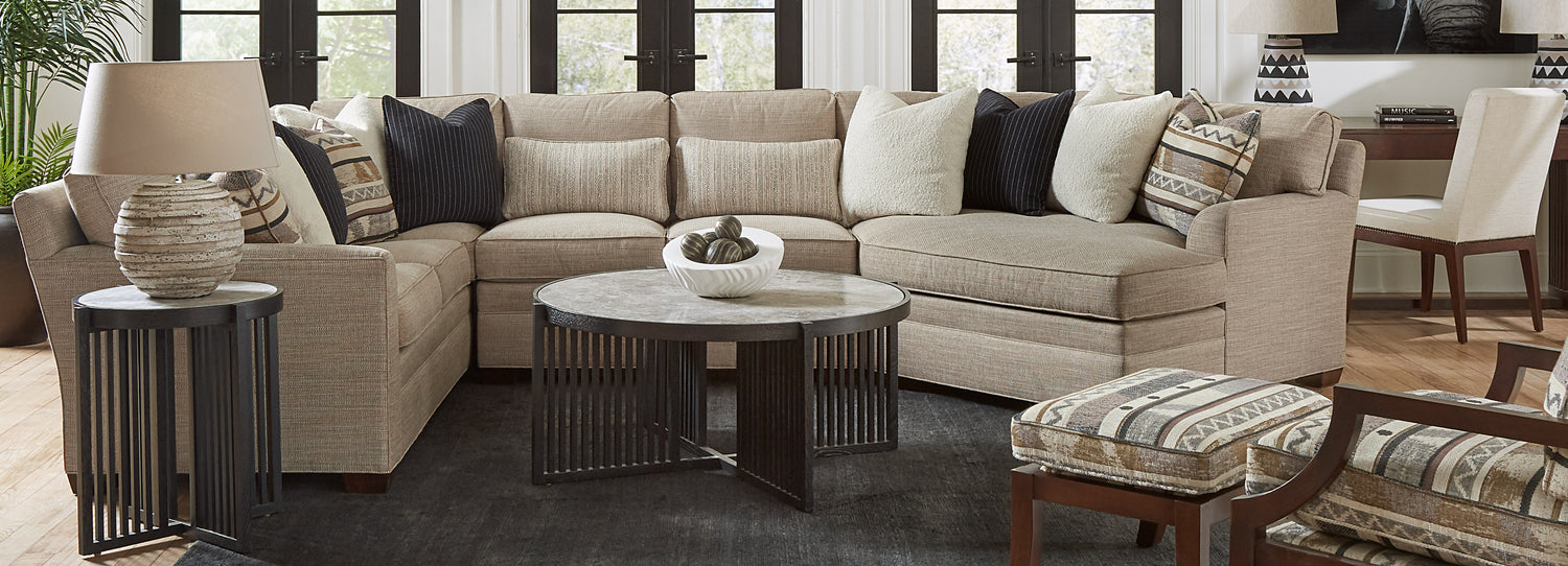 Stickley gray sectional with print chair and ottoman and matching sectional print pillows