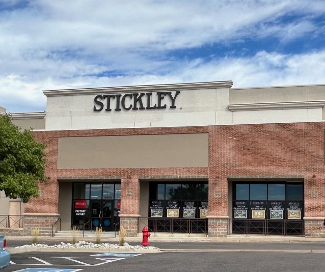 Exterior of the Stickley Factory Outlet in a red brick retail plaza.